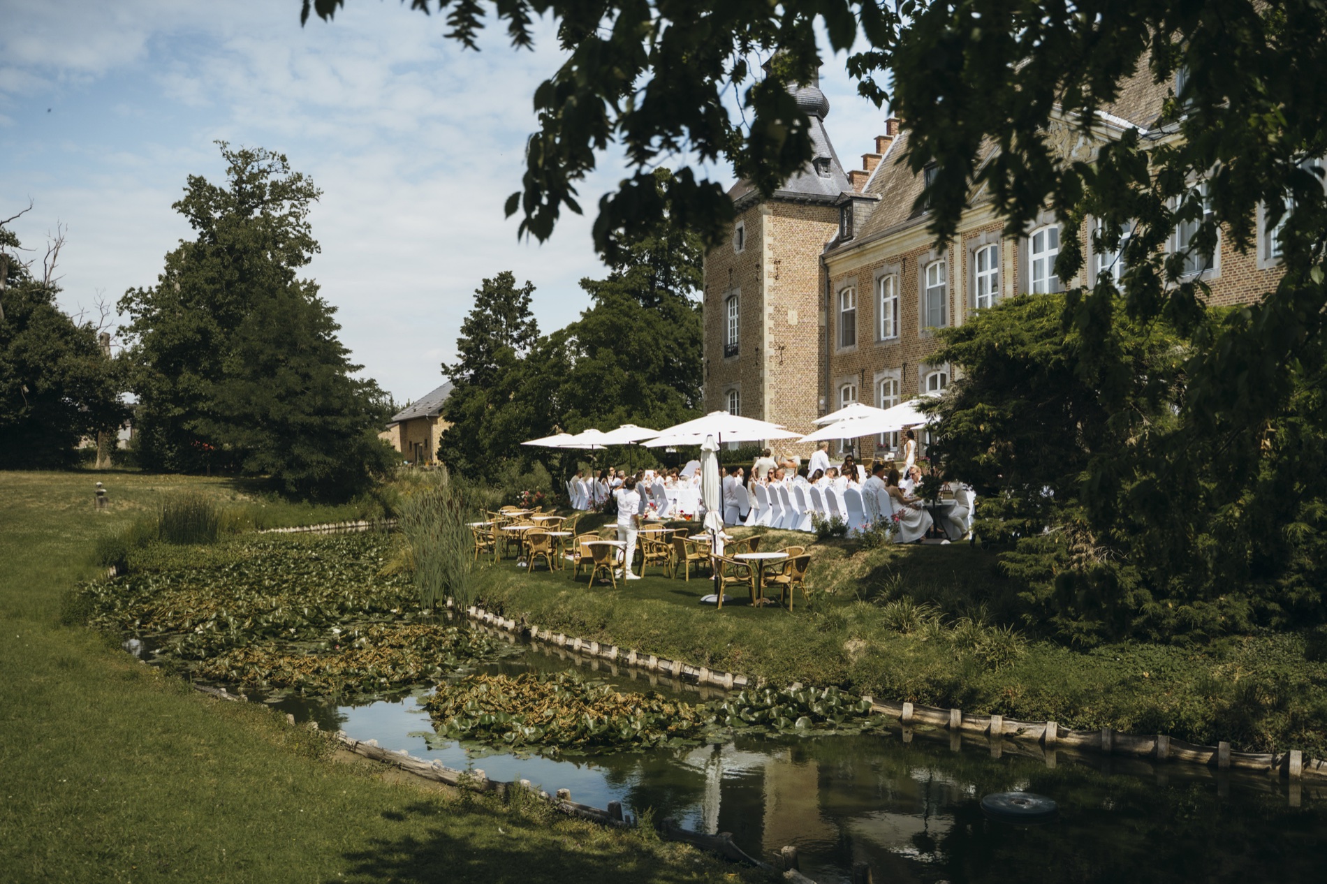 Waterside celebration beside Chateau de Looz