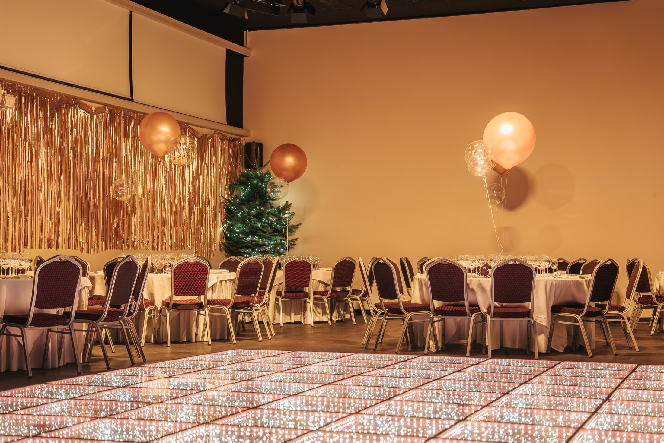 Large event hall dressed for a gala dinner