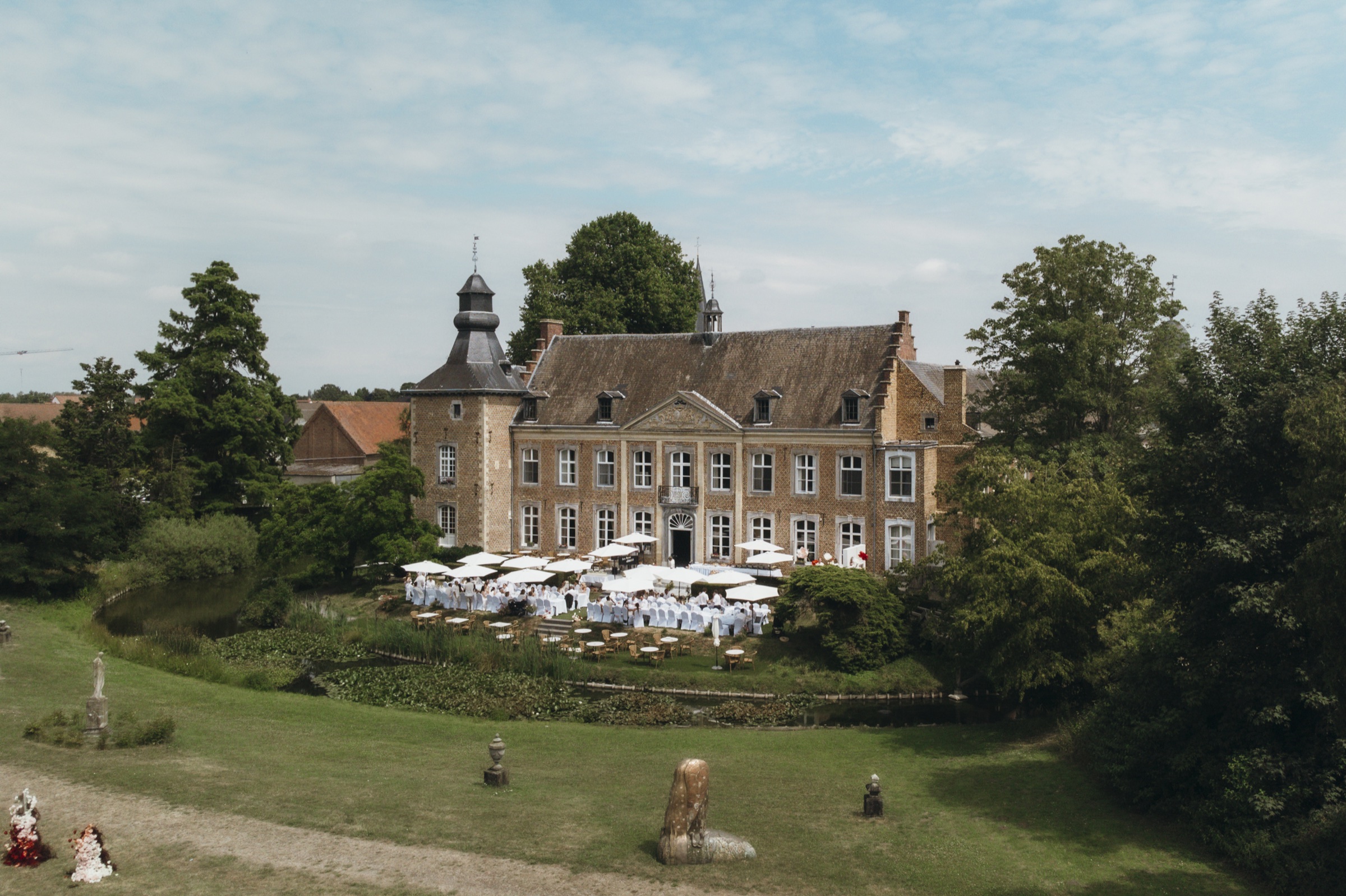 Aerial view of a wedding reception in the gardens of Chateau de Looz