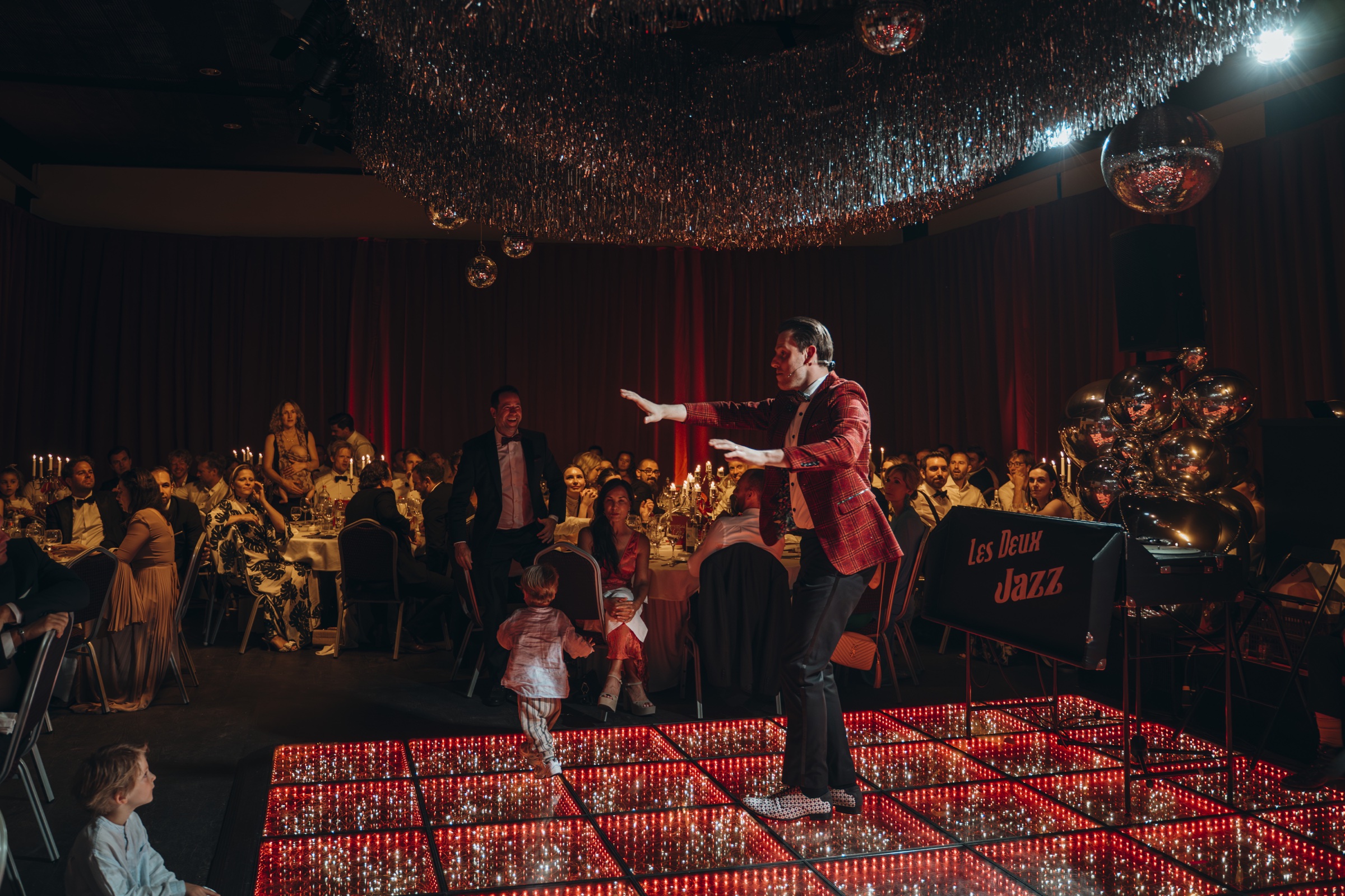 Evening entertainment among wedding guests at Chateau de Looz