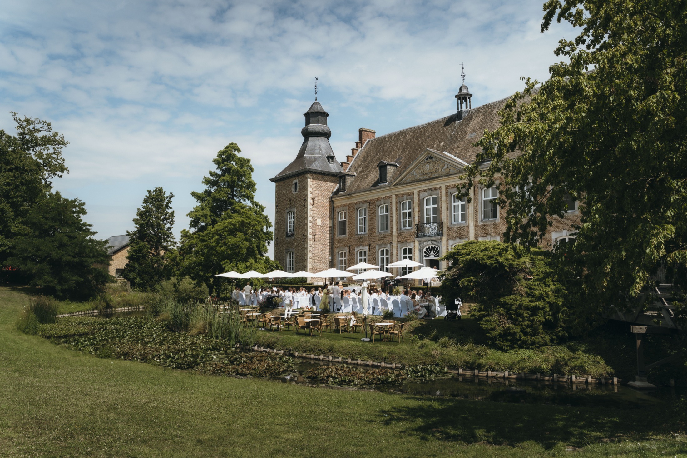Outdoor wedding reception beside the water
