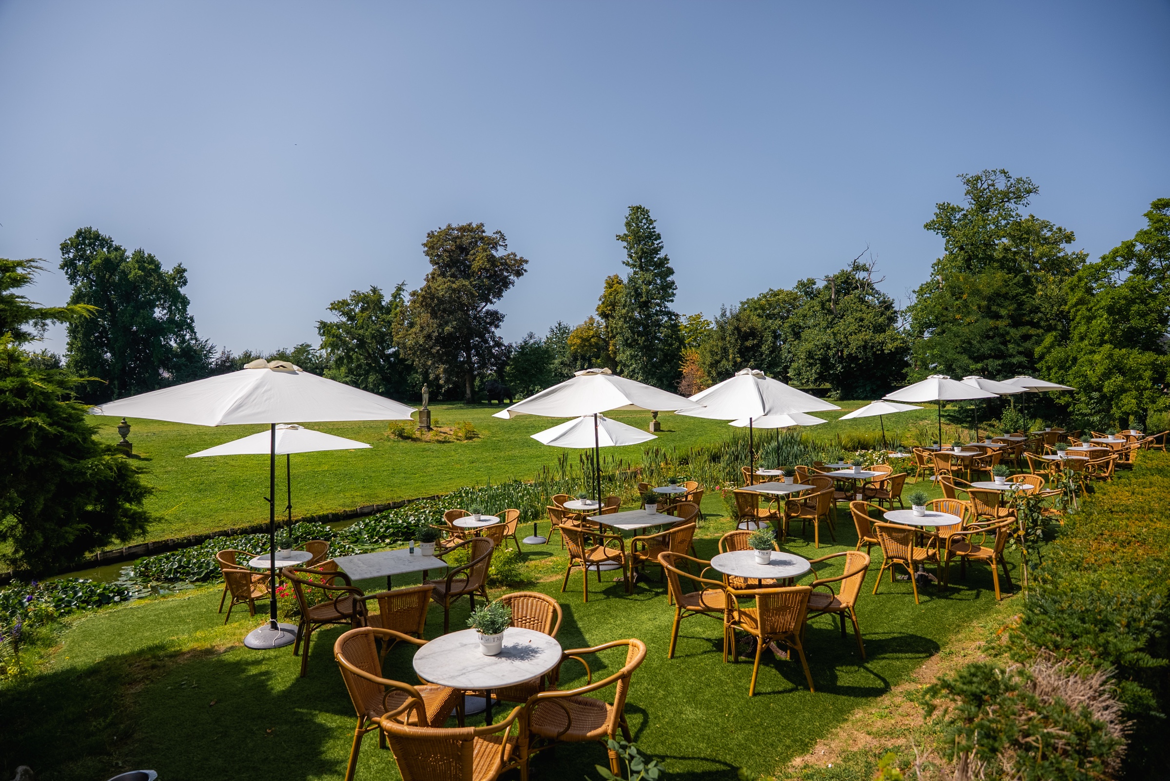 Waterside garden terrace at Château de Looz